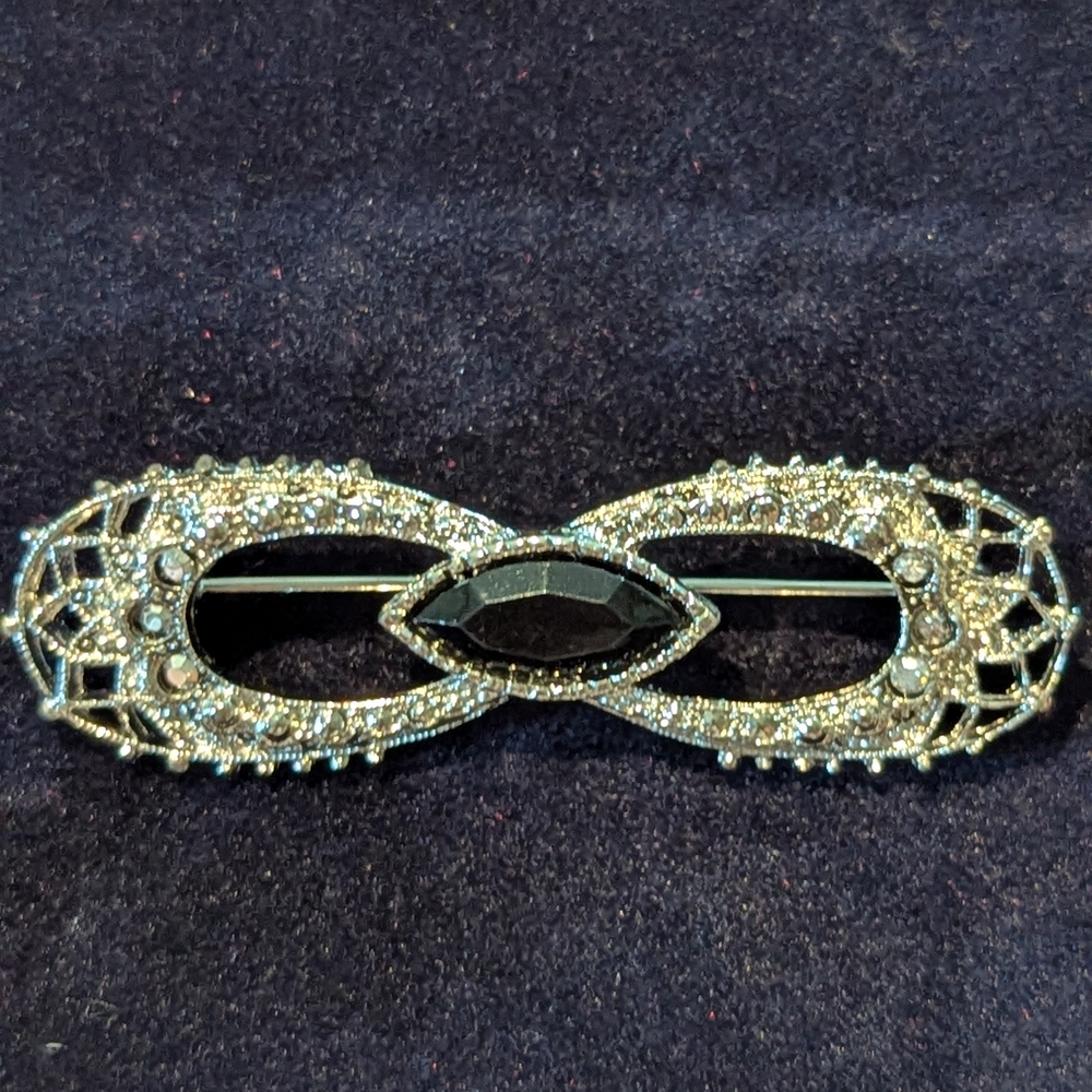 Elegant Silver and Black Brooch